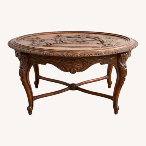 Used Carved Oval Table  for sale on AptDeco