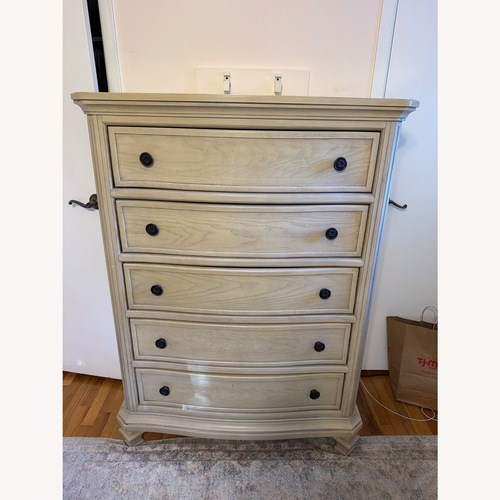 Used Ashley Furniture Light Brown Wood Dresser for sale on AptDeco