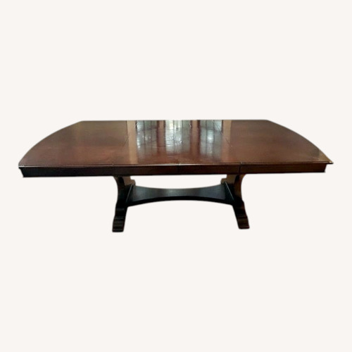 Used Raymour & Flanigan Solid Wood Dining Table for sale on AptDeco