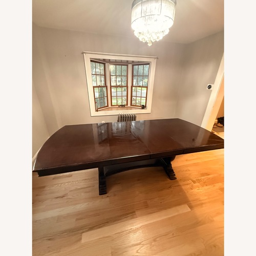 Used Raymour & Flanigan Solid Wood Dining Table for sale on AptDeco