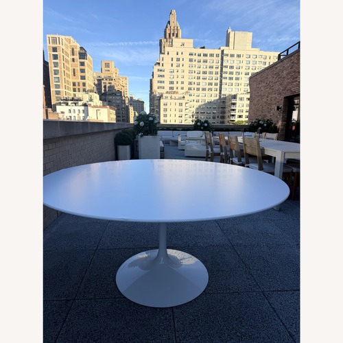 Used Knoll Saarinen White Aluminum Dining Table for sale on AptDeco