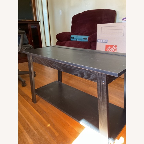 Used Black Wood Coffee Table for sale on AptDeco