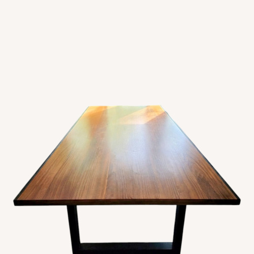Used Dark Brown Wood Dining Table for sale on AptDeco