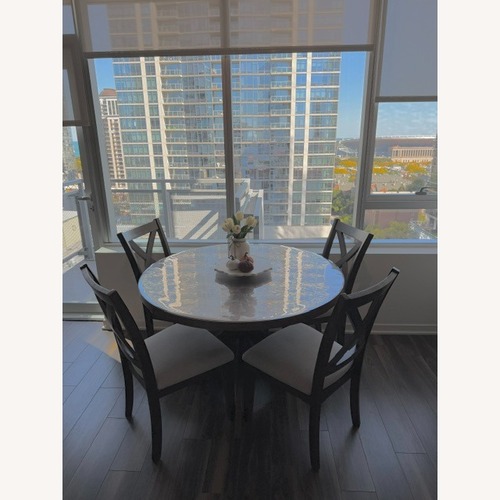 Used Dark Brown Wood Dining Set for sale on AptDeco