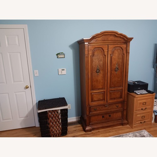 Used Dark Brown Wood Armoire for sale on AptDeco