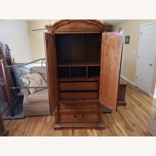 Used Dark Brown Wood Armoire for sale on AptDeco