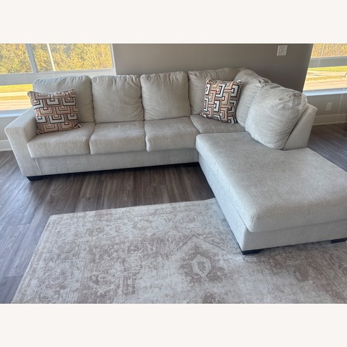 Used Stone 2 Piece Sectional with Right-Facing Chaise for sale on AptDeco