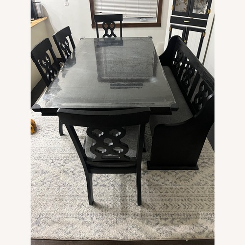 Used Raymour & Flanigan Black Wood Dining Set for sale on AptDeco