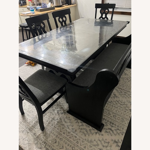 Used Raymour & Flanigan Black Wood Dining Set for sale on AptDeco
