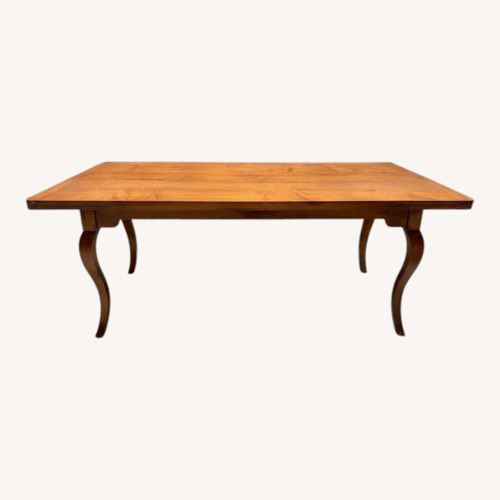 Used Light Brown Wood Dining Table for sale on AptDeco