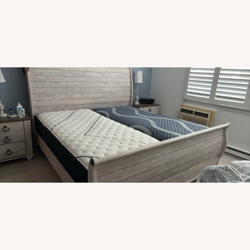Used Ashley Furniture Wood King Bed for sale on AptDeco
