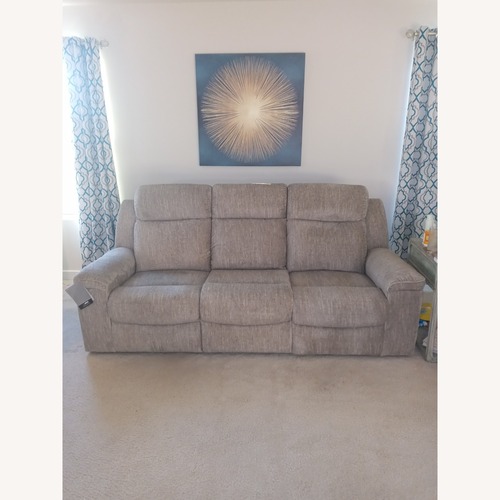 Used Ashley Furniture Light Gray Manual Reclining Sofa for sale on AptDeco