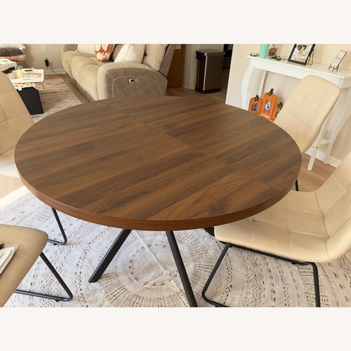 Used Dark Brown Wood Dining Table for sale on AptDeco