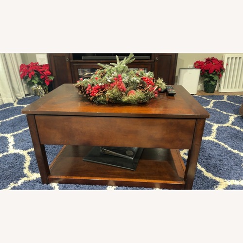 Used Dark Brown Wood Coffee Table for sale on AptDeco