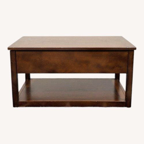 Used Dark Brown Wood Coffee Table for sale on AptDeco