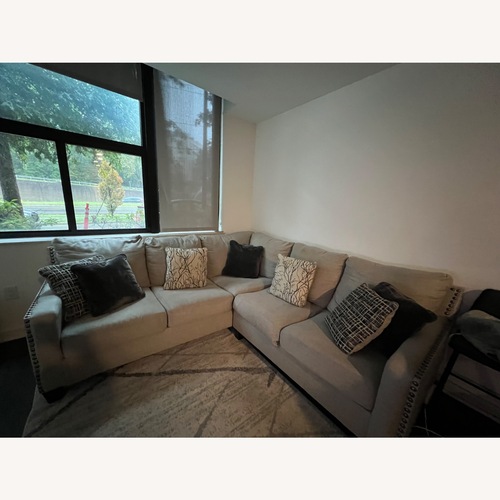 Used Ashley Furniture Light Frey 2 Piece Sectional Sofa for sale on AptDeco