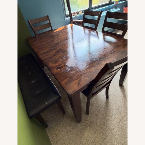 Used Raymour & Flanigan Dark Brown Wood Dining Set for sale on AptDeco