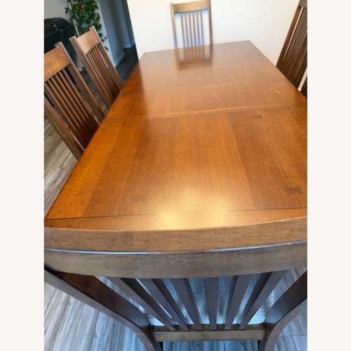 Used Light Brown Wood Dining Table for sale on AptDeco