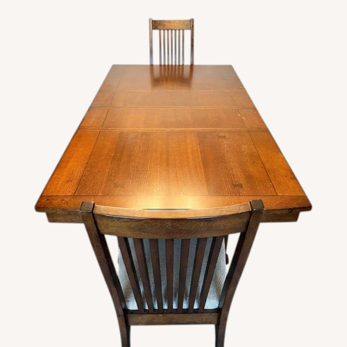 Used Light Brown Wood Dining Table for sale on AptDeco