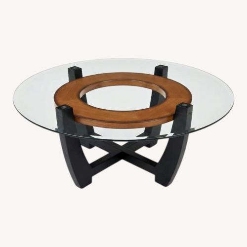 Used Raymour & Flanigan Transparent Glass Coffee Table for sale on AptDeco