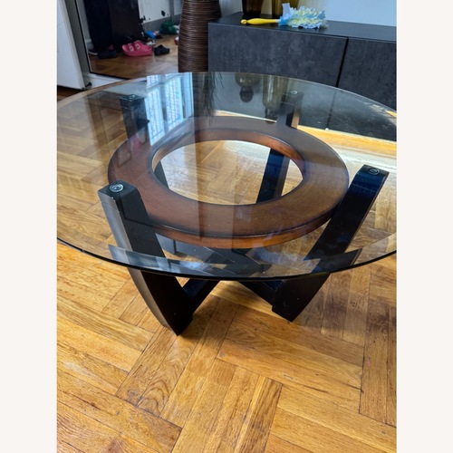 Used Raymour & Flanigan Transparent Glass Coffee Table for sale on AptDeco