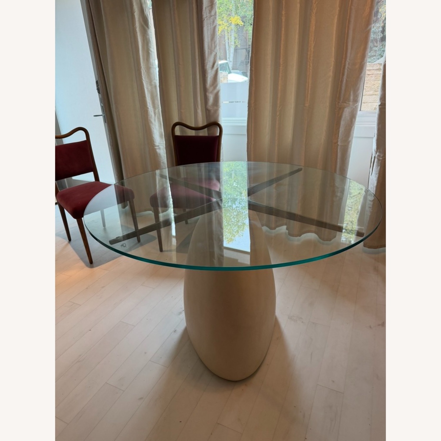 CB2 Stone 47" Round White Concrete Dining Table with Glass Top - image-3