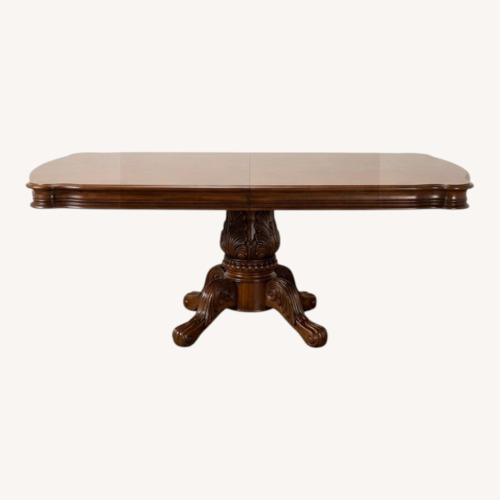 Used Dark Brown Mahogany Wood Dining Table for sale on AptDeco
