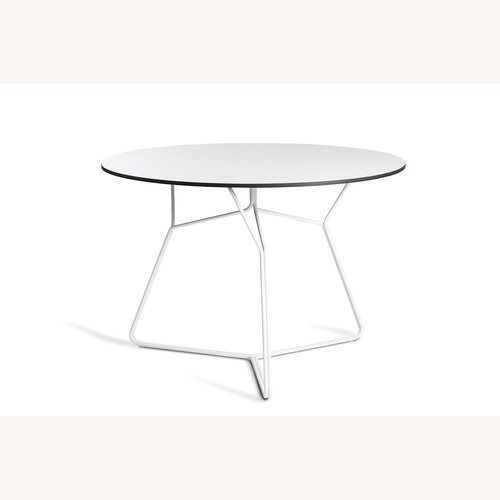 Used Oasiq Serac Dining Table for sale on AptDeco