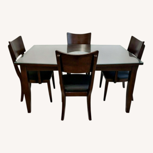 Used Dark Wood Dining Table with Glass Top and 4 Chairs for sale on AptDeco