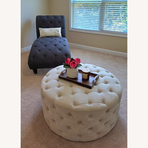 Used Tufted Fabric Round Ottoman for sale on AptDeco
