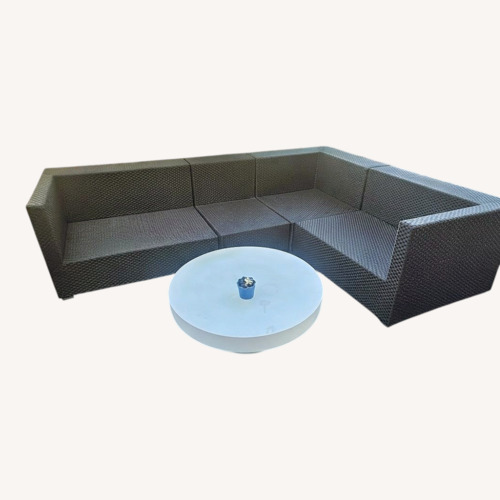 Used Dedon Wicker Corner Group and Matching Side Table for sale on AptDeco