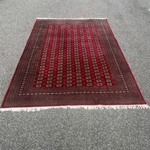 Used Red Bokhara Hand Knotted Wool 9' x 12' Area Rug  for sale on AptDeco