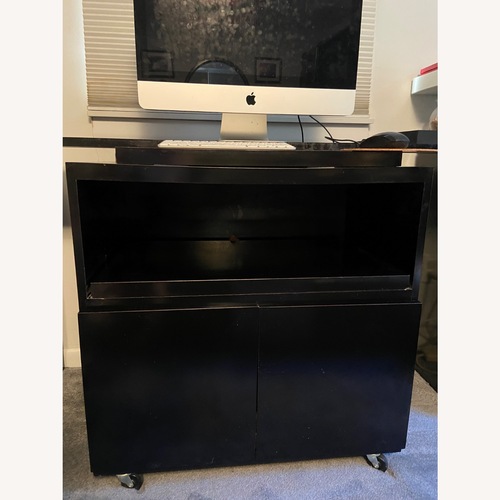 Used Black Mica TV Stand with Swivel Top and Storage for sale on AptDeco