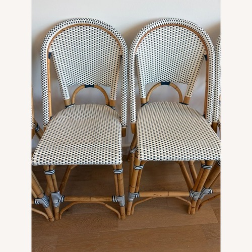 Used Serena & Lily Riviera Rattan Counter Stools 4 for sale on AptDeco