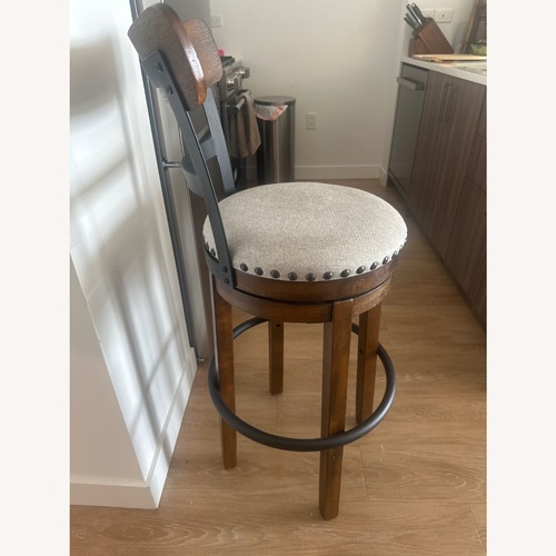 Used Ashley Valebeck Brown Back Wood Bar Height Stool for sale on AptDeco