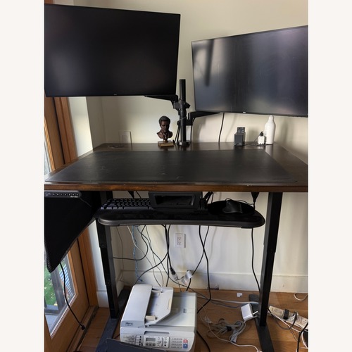 Used Uplift V2 Standing Desk Solid Dark Rubberwood for sale on AptDeco