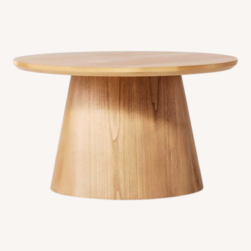 Used Magnolia Wooden Round Pedestal Coffee Table for sale on AptDeco