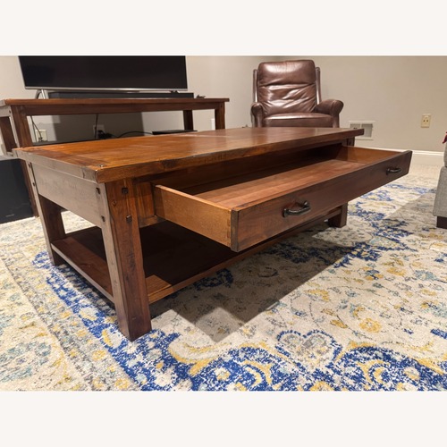 Used World Market Dark Brown Wood Coffee Table for sale on AptDeco