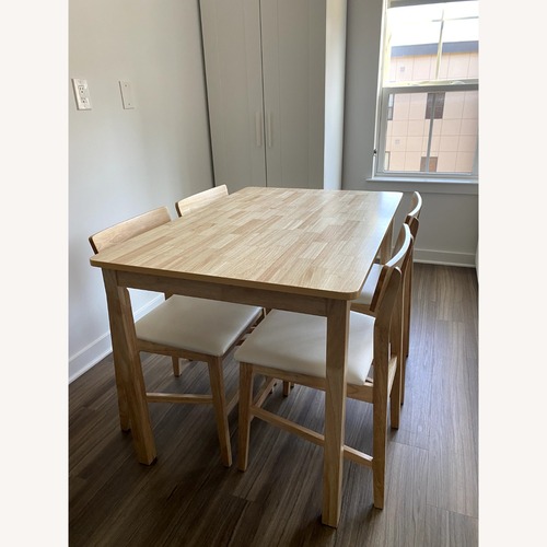 Used 5-Piece Natural Wood Dining Set for sale on AptDeco