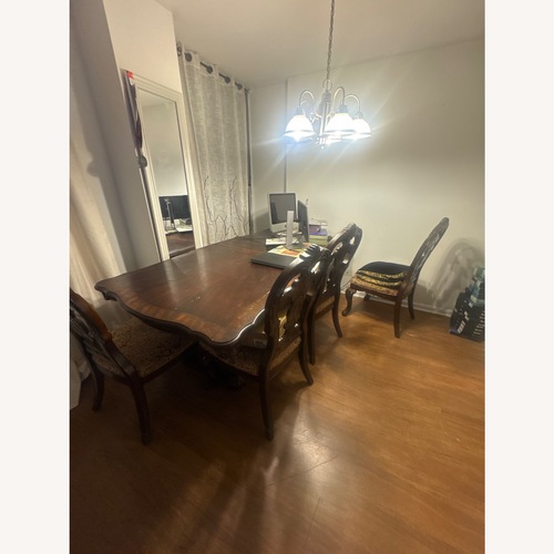 Used Vintage/Antique Finds Dark Brown Dining Table for sale on AptDeco