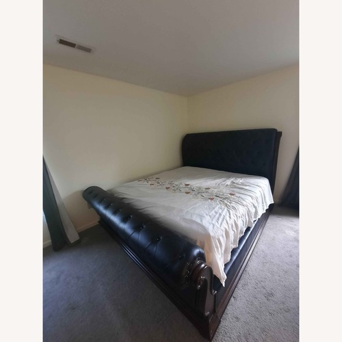 Used Starwood Furniture Dark Grey leather King Bed for sale on AptDeco