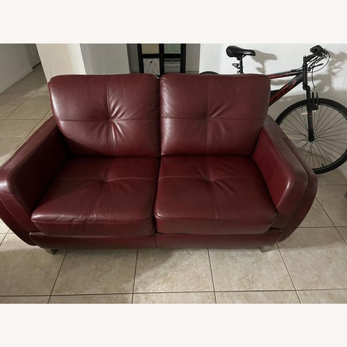Used Cindy Crawford Burgundy Leather Loveseat for sale on AptDeco