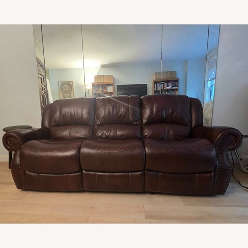 Used Raymour & Flanigan Power Leather Reclining Sofa for sale on AptDeco