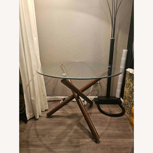 Used Modern Round Glass Dining Table for sale on AptDeco