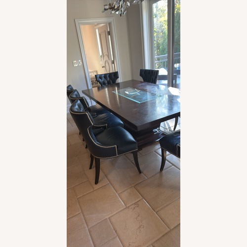 Used Dark Brown Wood Dining Table for sale on AptDeco