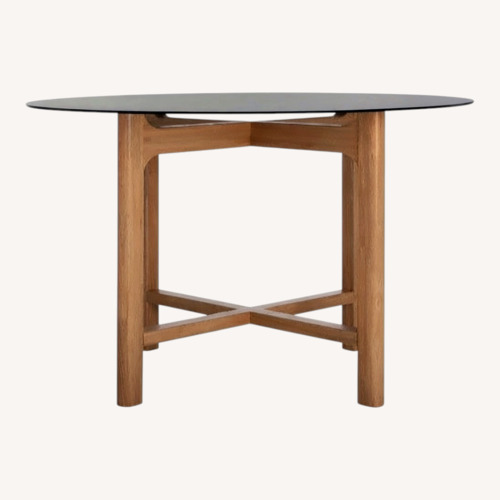 Used Safavieh Couture Black Glass Dining Table for sale on AptDeco