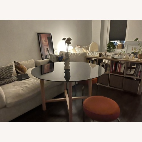 Used Safavieh Couture Black Glass Dining Table for sale on AptDeco