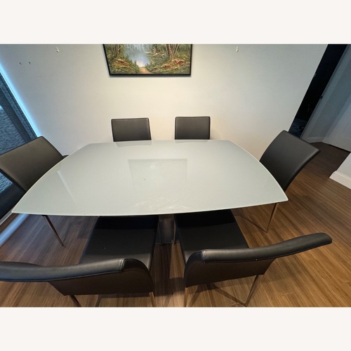 Used Frosted Dining Table with 8 Chairs for sale on AptDeco