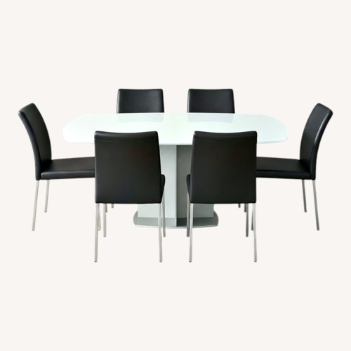 Used Frosted Dining Table with 8 Chairs for sale on AptDeco