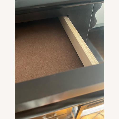 Used Black Wood Dresser with Hidden Drawer for sale on AptDeco